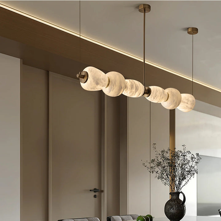 Alabaster Pebble linear chandelier luxury lighting with a side view highlighting elegant contemporary design