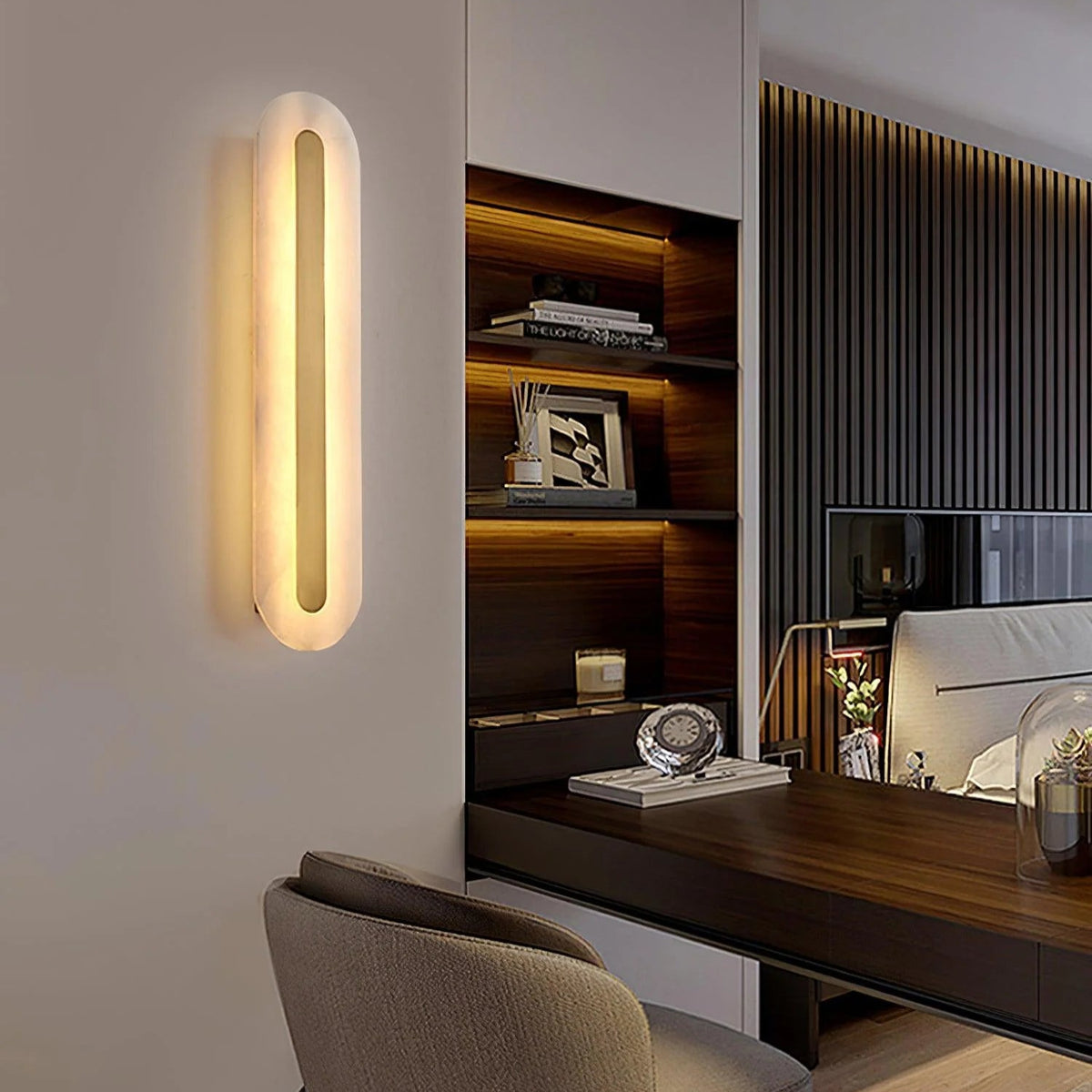 Alabaster rounded marble wall light beside table, stylish lighting decor for modern interiors