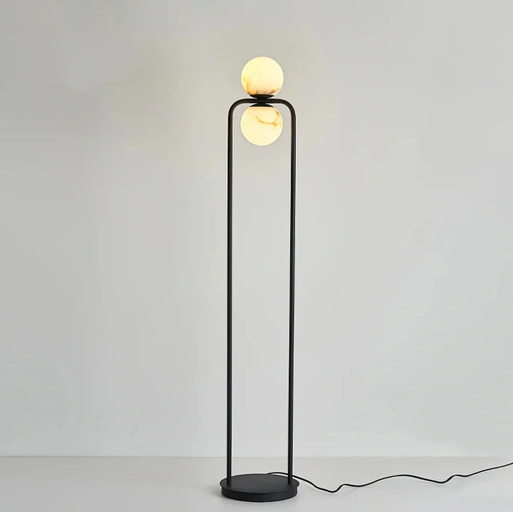 Alabaster Tribeca floor lamp with two black metal stands and round marble bases, modern elegant lighting