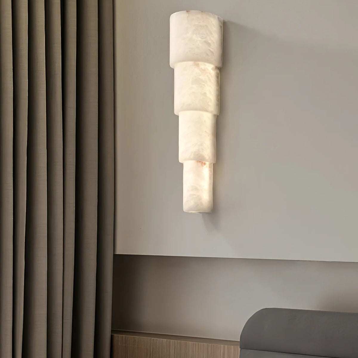 Bedside view of Alba Cascade alabaster wall sconce modern lighting for elegant bedroom décor