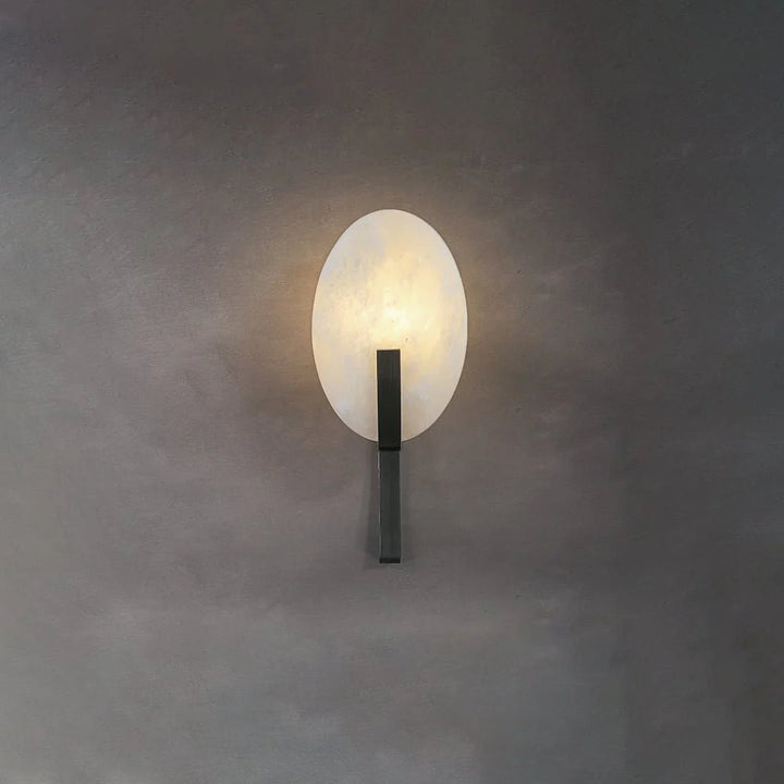 Alice alabaster modern plug-in wall light front view with black metal finish showcasing elegant design