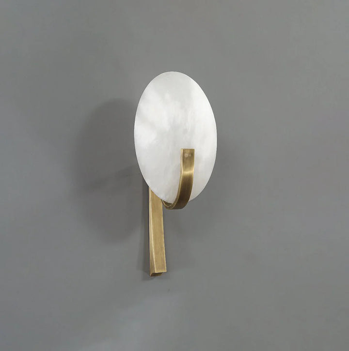 Side view of Alice Alabaster wall lamp with golden metal finish