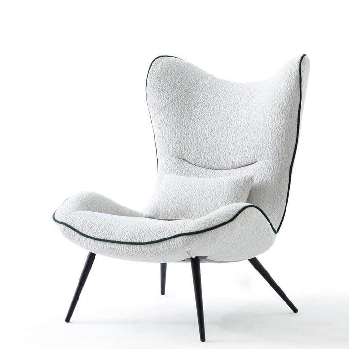  Side view of AltaWing custom wingback lounge chair with textured upholstery and contrast piping