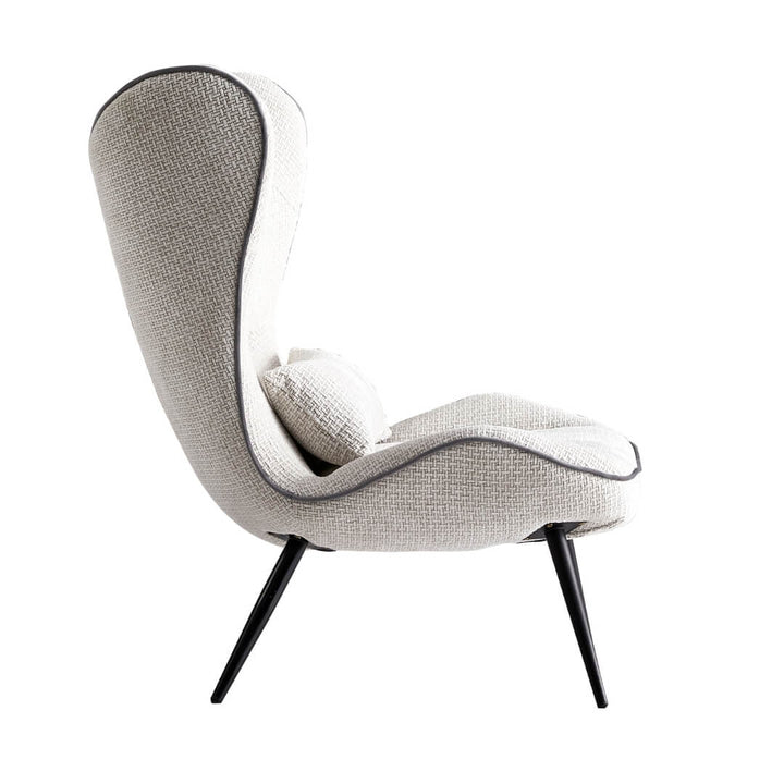 Side view of Altawing custom wingback chair in elegant interior – detailed upholstery and classic silhouette