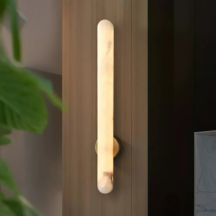 Alunari modern wall sconce light front angle view, showcasing elegant contemporary design for stylish interiors