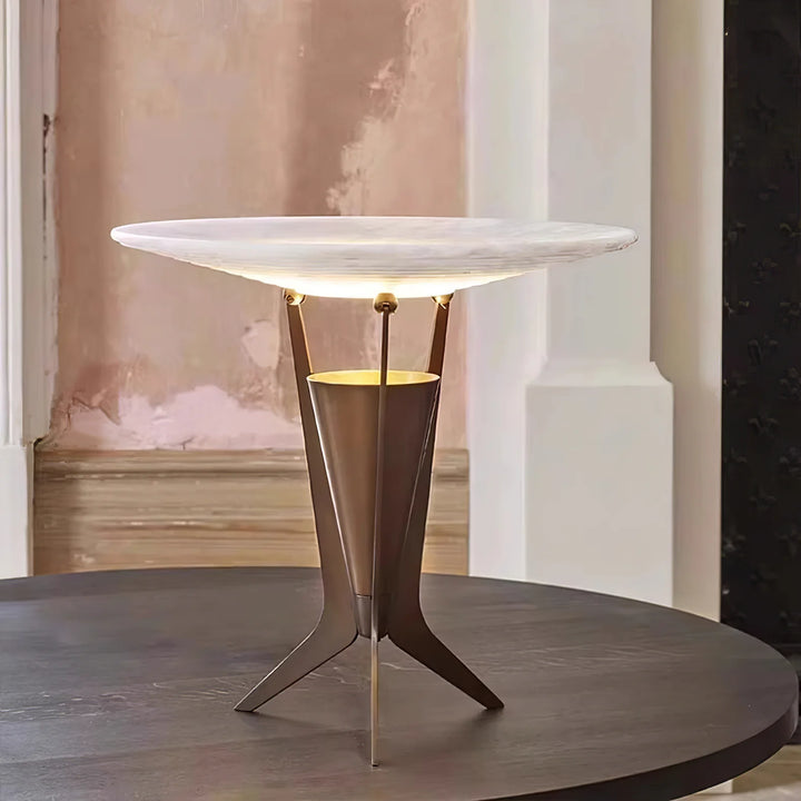 Front view of Aragon table lamp turned on, showcasing warm ambient lighting and modern sleek design