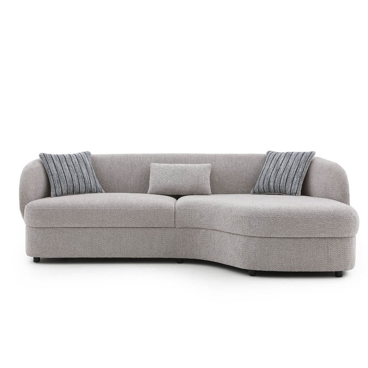 Rear angle view of Arco lounge sofa highlighting its modern design and plush cushions.