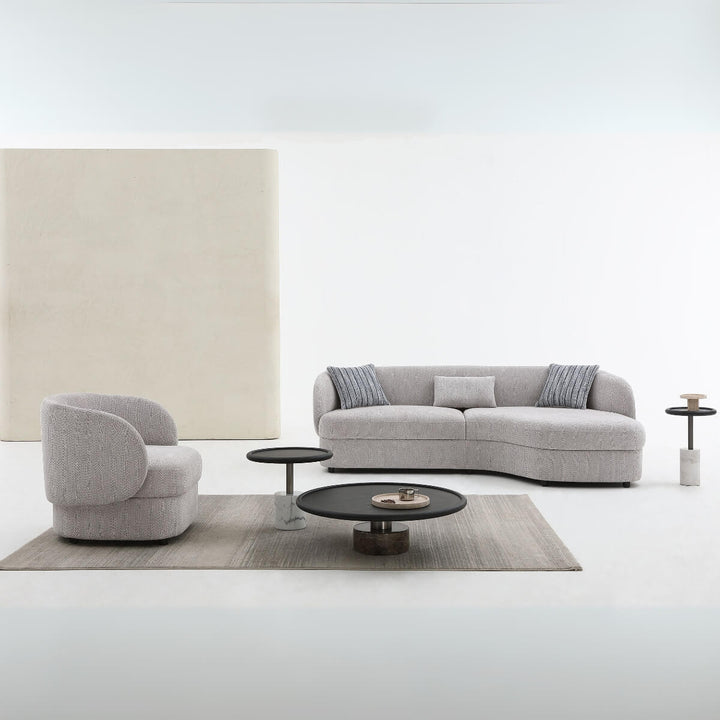 Close-up view of Arco lounge sofa highlighting plush cushions and modern fabric upholstery.
