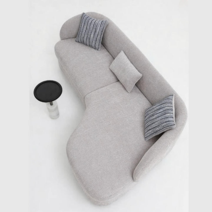 Side angle view of Arco lounge sofa showcasing plush cushions and contemporary design