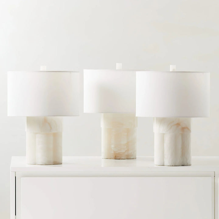 Three Athena alabaster table lamps on table, elegant lighting for modern home interior