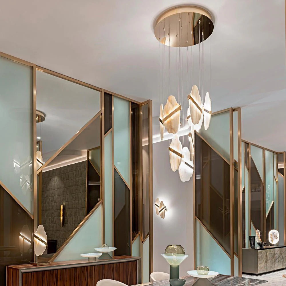 Auralith chandelier front view in living room with marble accents and multi-tier crystal design, luxurious lighting