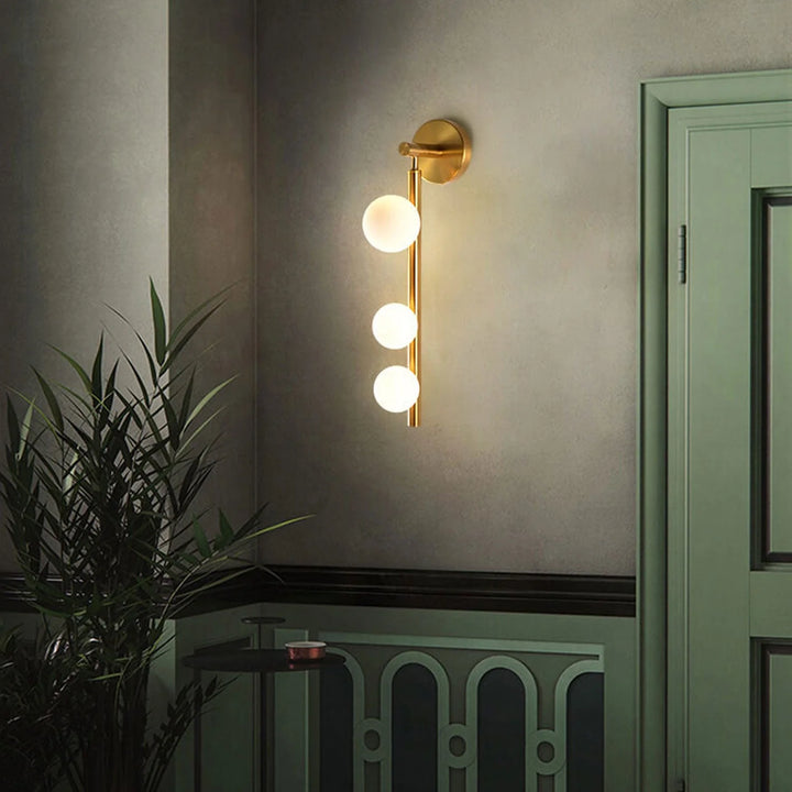 Aurora Trio Globe Wall Sconce light, stylish metal and glass wall fixture with G9 bulb for modern interiors