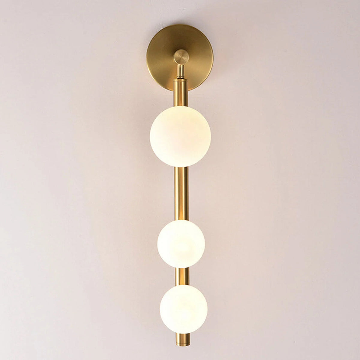 Aurora Trio Globe Wall Sconce light front view, modern metal and glass design with G9 bulb fixture