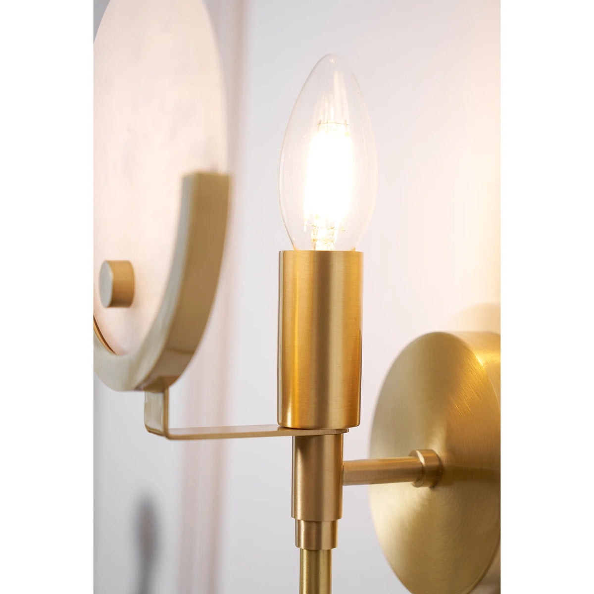 Detail view of Ava brass wall lamp lighting, showcasing elegant wall-mounted fixture and fine design