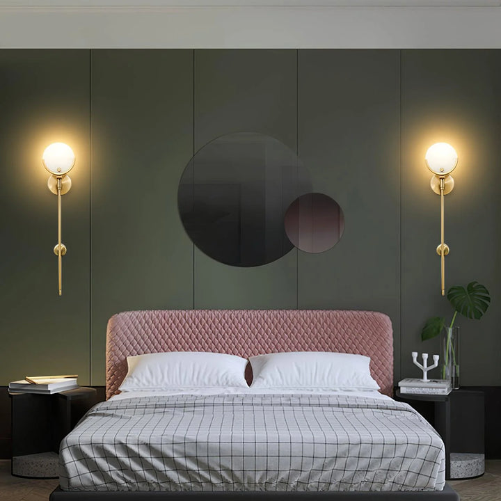 Bedside wall view of Ava brass wall lamp, stylish wall-mounted lighting fixture for modern bedroom