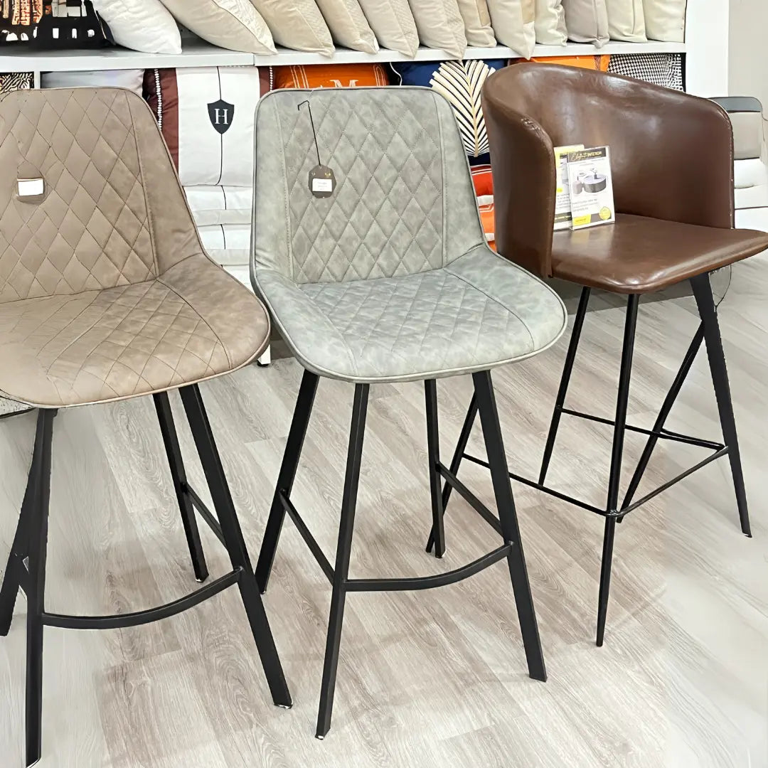 Baxter modern bar stool with adjustable counter-height seating, featuring sleek design and comfortable cushioning