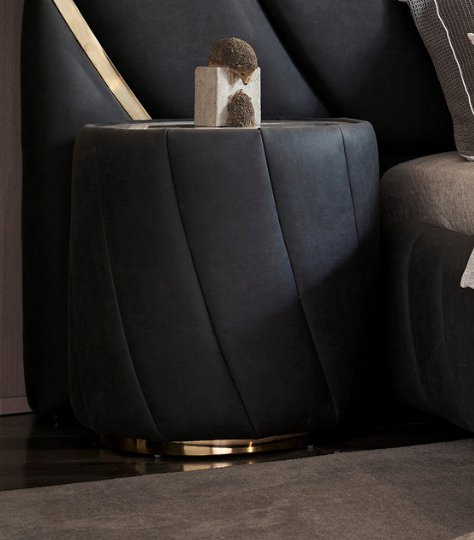 Black bedside table with modern aesthetic and storage drawer