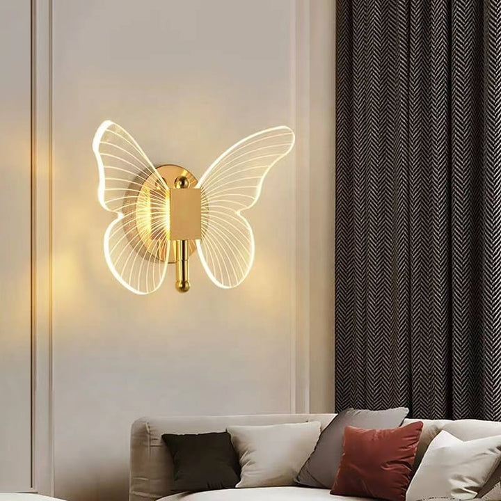 Side view of luxury gold butterfly wall lamp installed in living room, adding elegant decorative lighting
