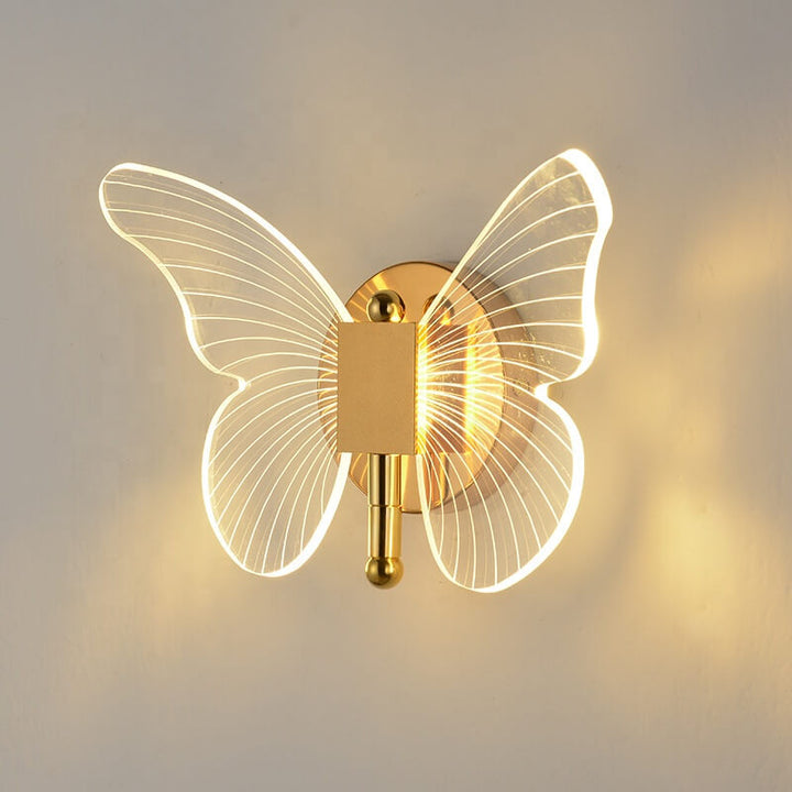 Close-up view of luxury gold butterfly wall lamp showcasing intricate design and polished finish