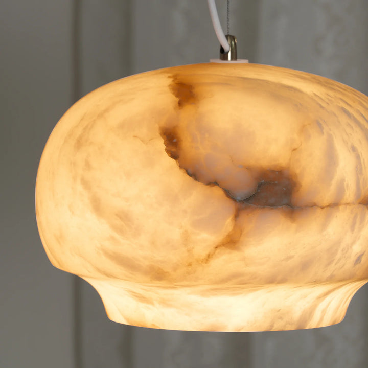 Camille alabaster pendant lamp hanging close view highlighting elegant modern lighting details