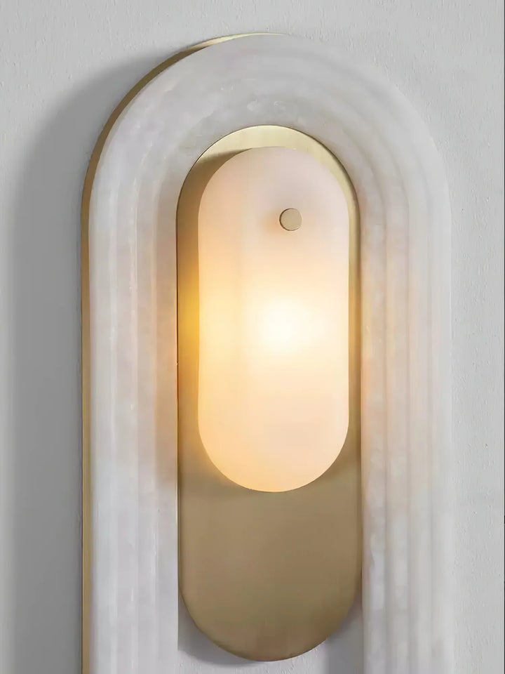 Cascada wall sconce head-on front view with alabaster shade and gold metal accents, elegant design
