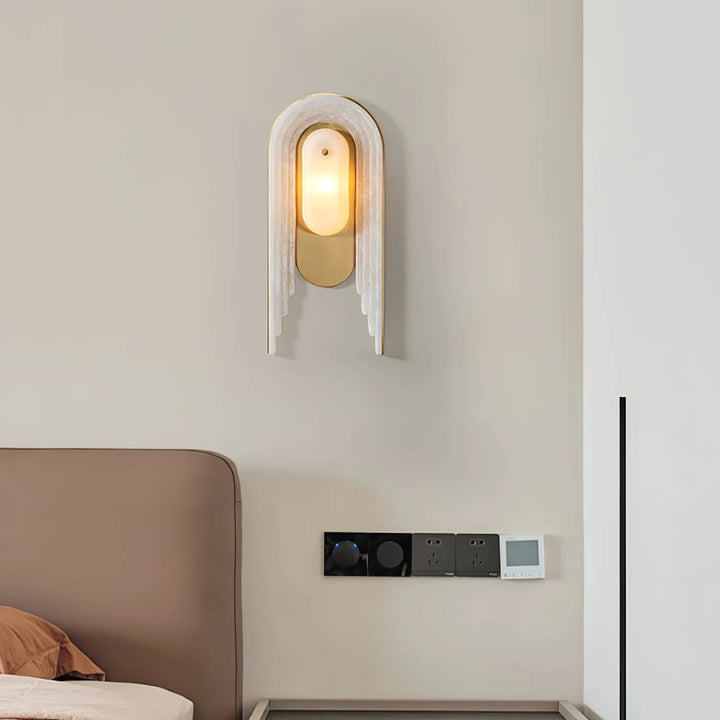 Cascada wall sconce front view featuring alabaster shade and gold metal accents, elegant lighting