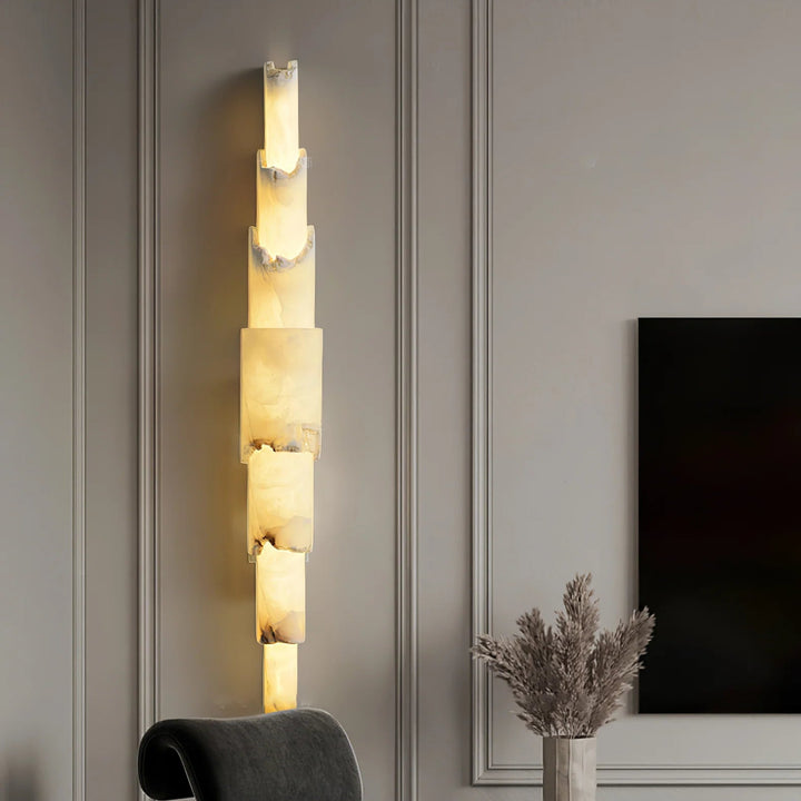Cascading alabaster wall sconce luxury lighting in a living room, shown from the front view