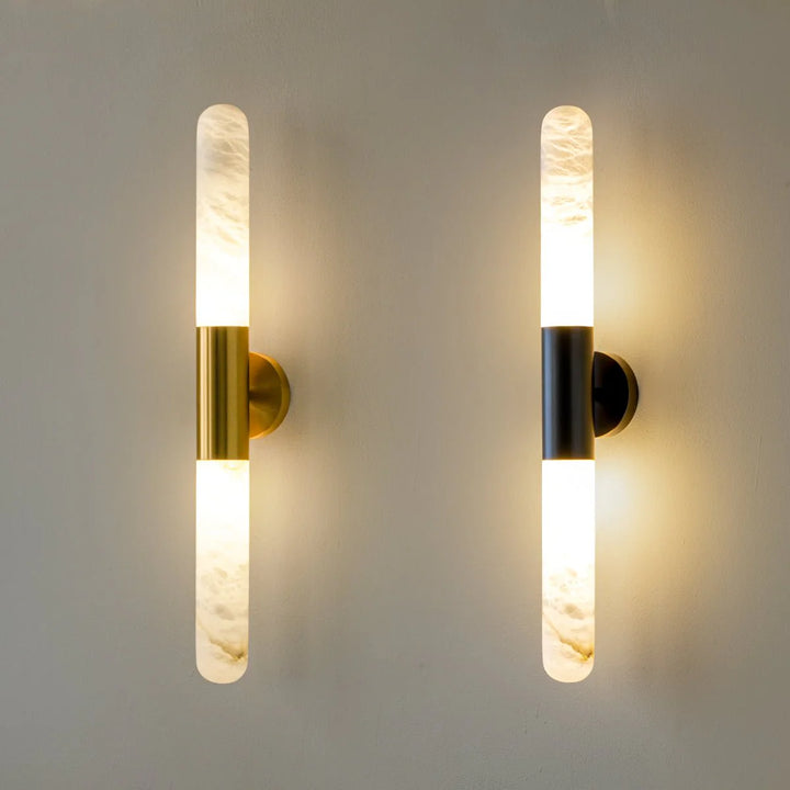Front angle view of Cavoya Alabaster Wall Light with gold and black wall mount, luxury lighting, elegant décor