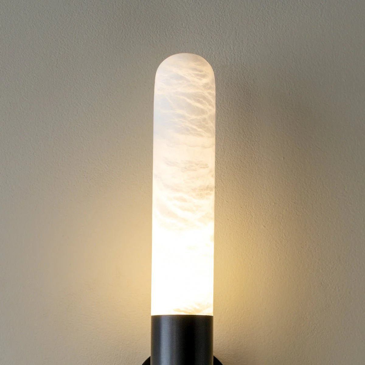 Front side view of Cavoya Alabaster Wall Light head, luxury lighting, elegant home interior décor