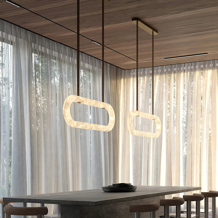 Circle alabaster chandelier above dining table – elegant modern lighting for stylish interiors