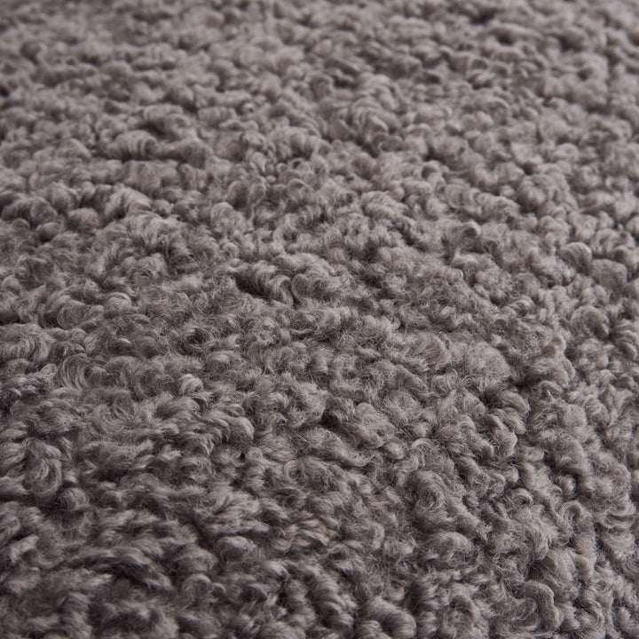 Close-up detail view of Cloud swivel lounge chair cushion showing soft fabric and plush texture