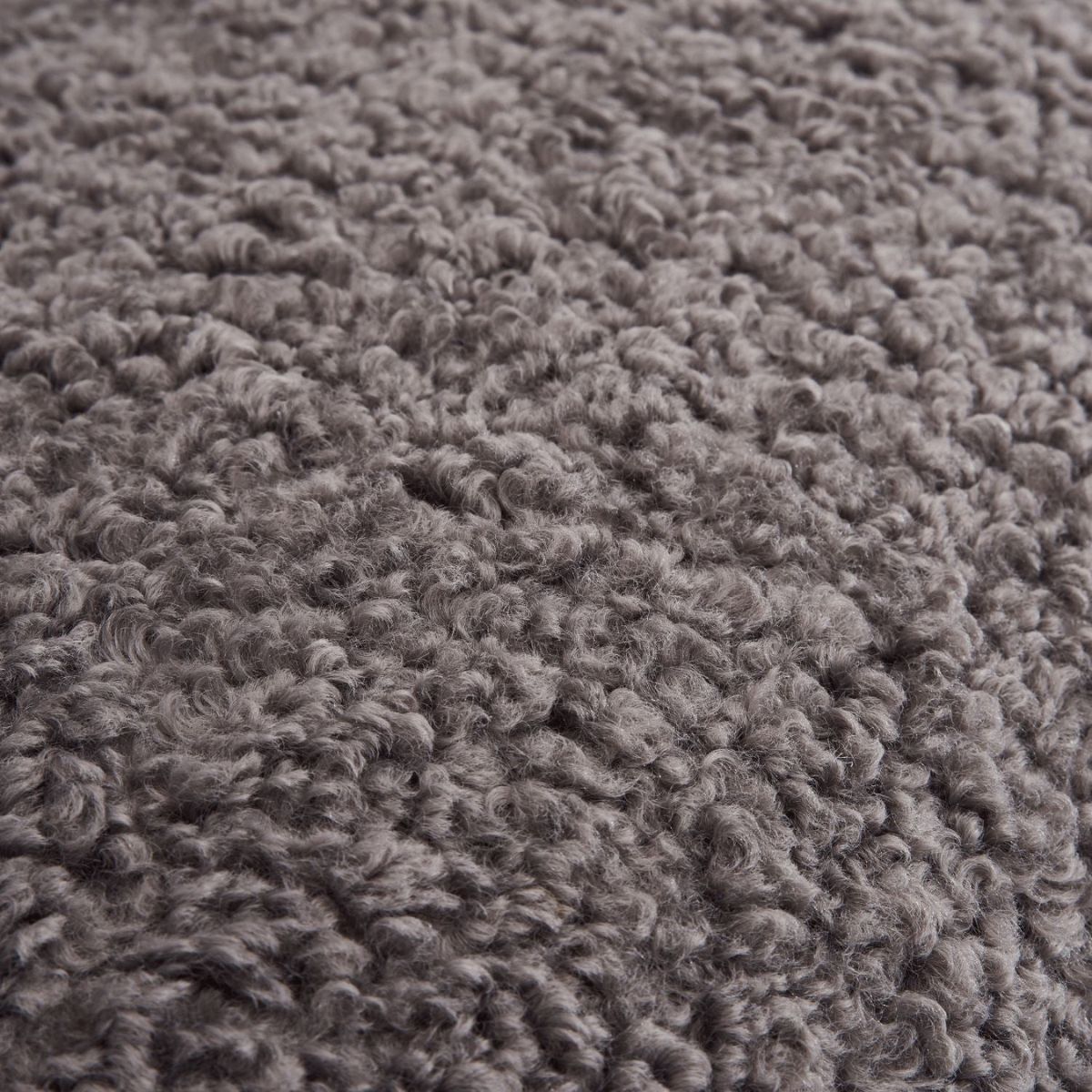 Close-up detail view of Cloud swivel lounge chair cushion showing soft fabric and plush texture