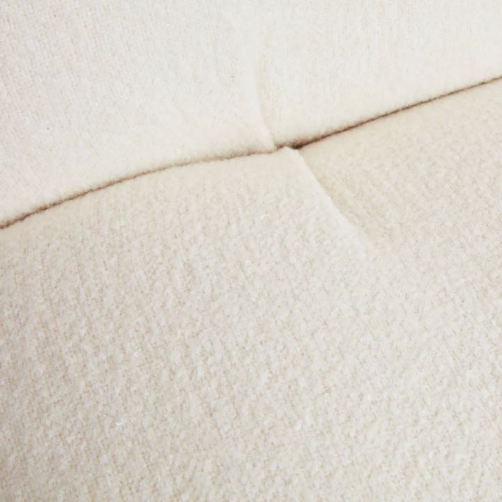Detail view of cloud swivel lounge chair cushion showing soft texture and premium upholstery