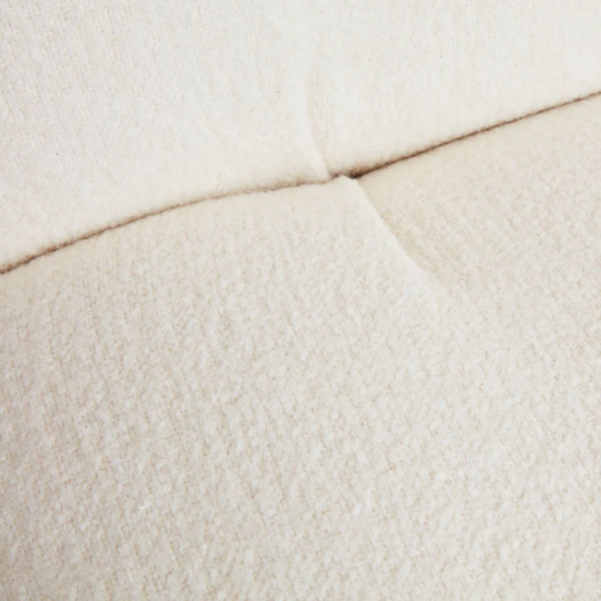 Detail view of cloud swivel lounge chair cushion showing soft texture and premium upholstery