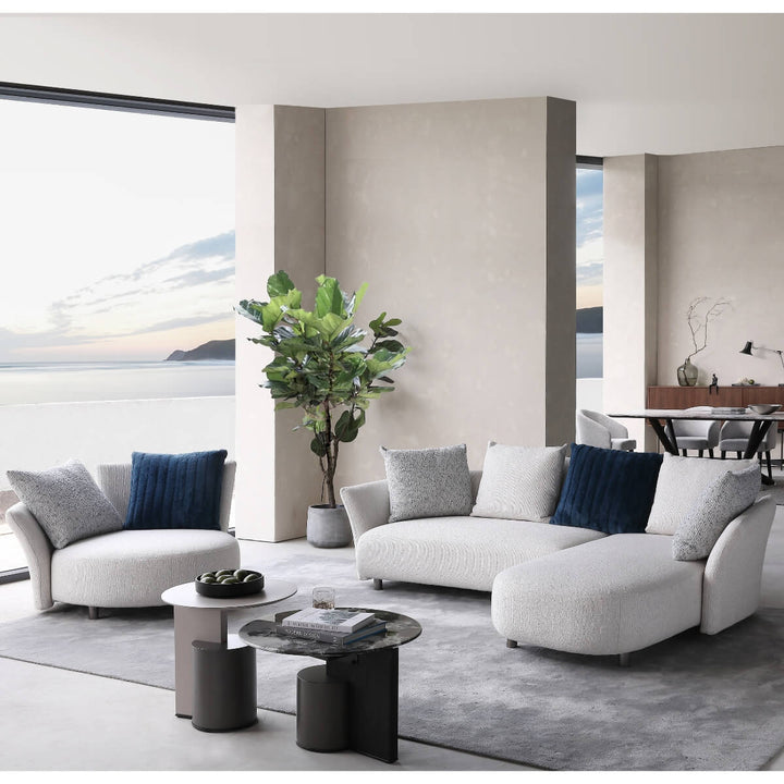 Front close-up view of Coastal Curve sofa lounge highlighting plush cushions and curved armrest design.
