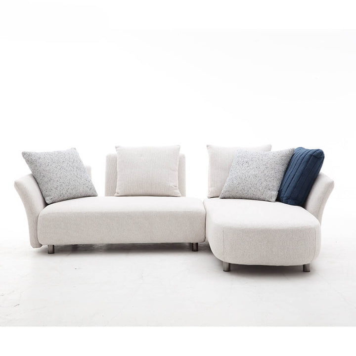Close-up view of Coastal Curve sofa lounge focusing on curved armrest and soft fabric upholstery.