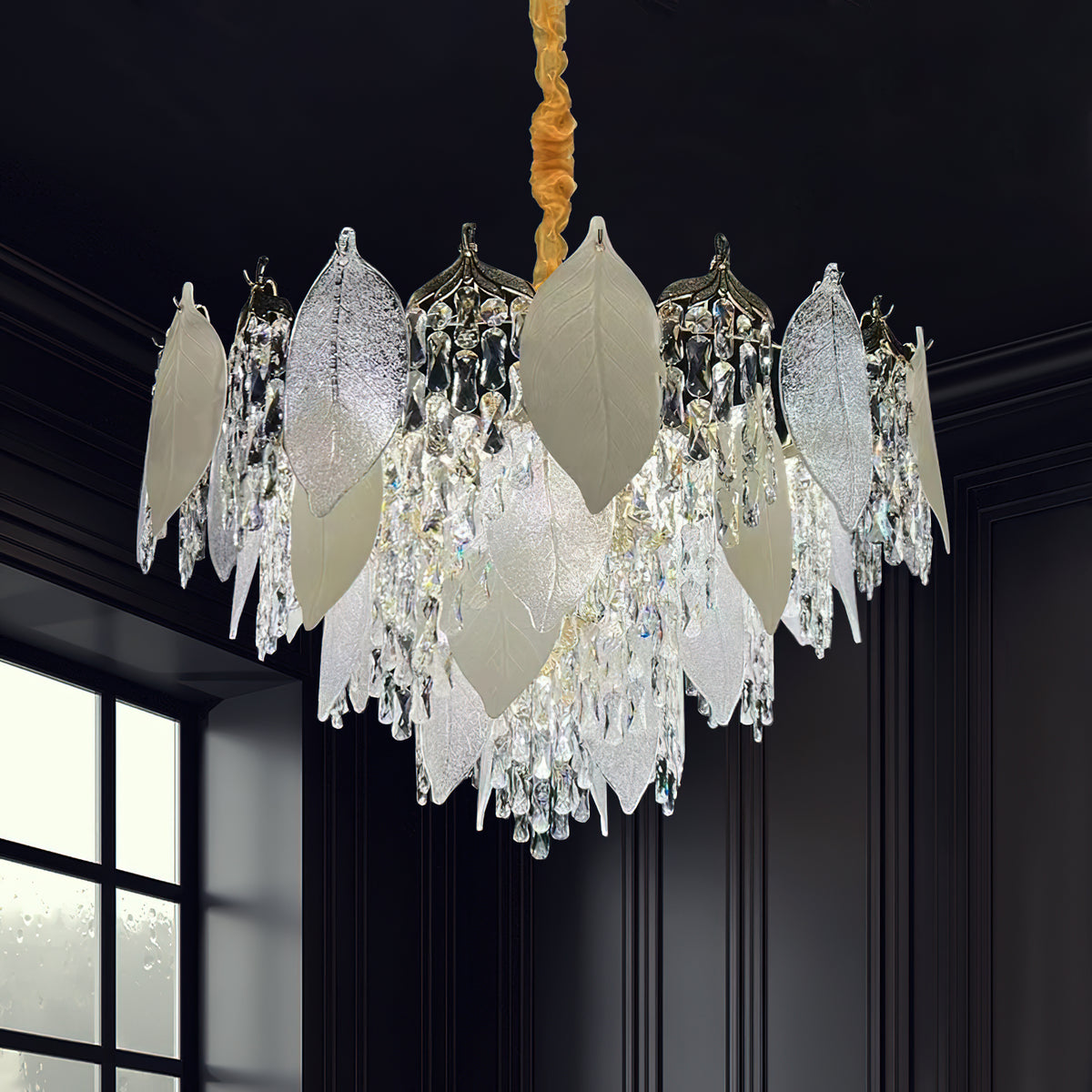 Front view of crystal leaf chandelier light in luxury room, showcasing intricate leaf-shaped crystals and radiant elegance