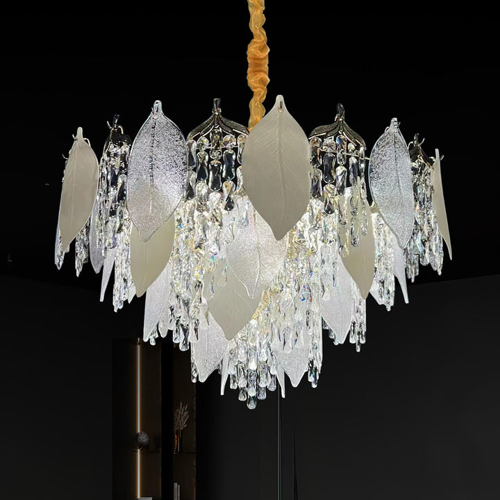 Front view of crystal leaf chandelier light in luxury room, featuring intricate leaf-shaped crystals and elegant sparkling design.