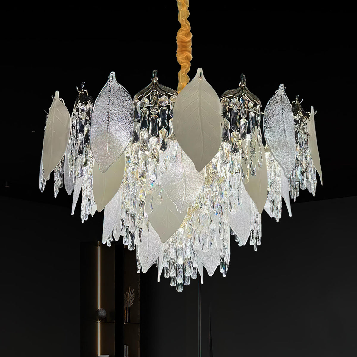 Front view of crystal leaf chandelier light in luxury room, featuring intricate leaf-shaped crystals and elegant sparkling design.