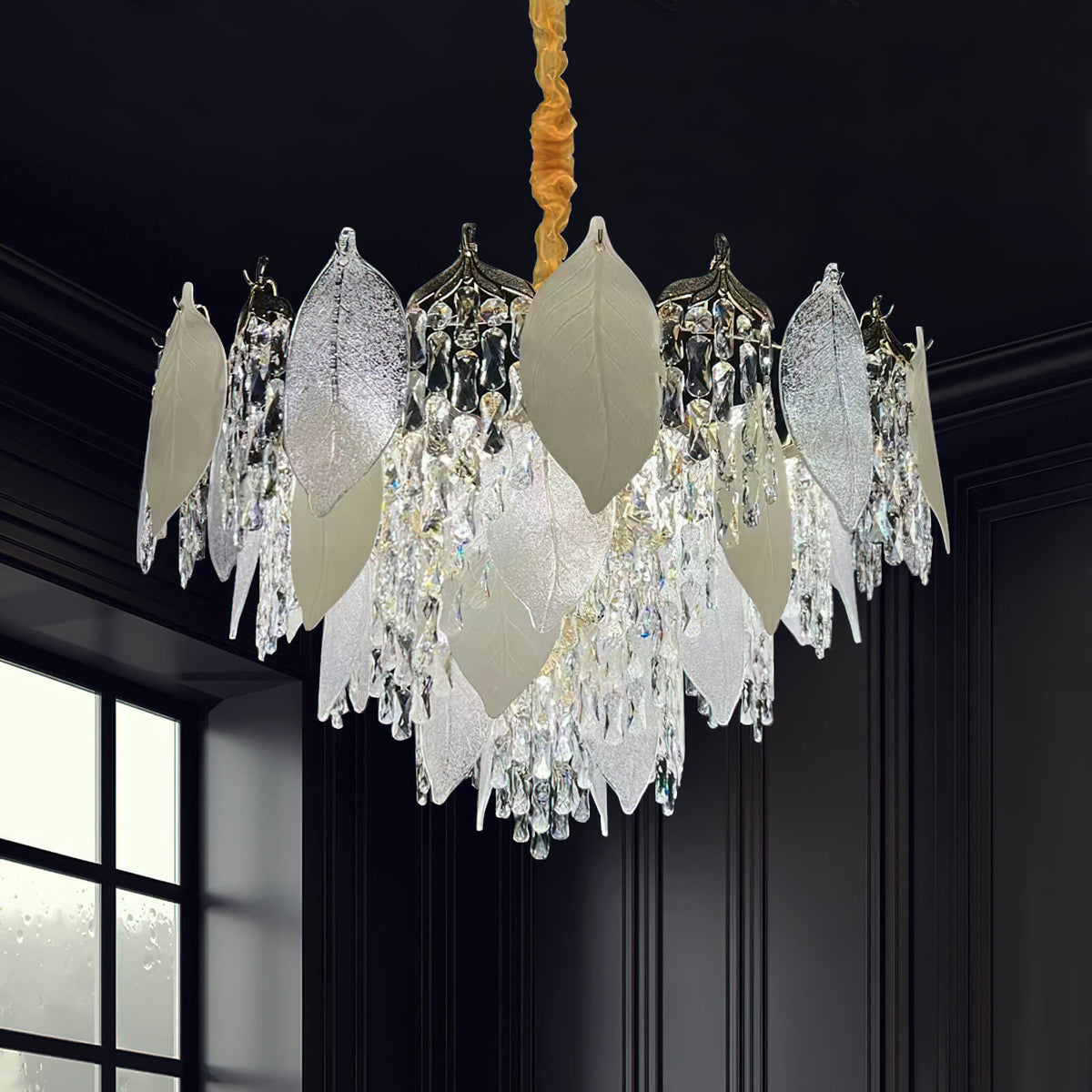 Front view of crystal leaf chandelier light in luxury room, featuring intricate leaf-shaped crystals and elegant sparkling design.