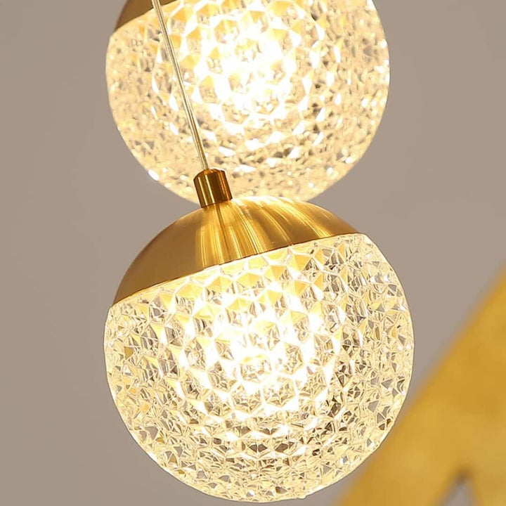Crystal prism pendant light with gold finish and LED bulb, featuring elegant design for sophisticated modern interiors