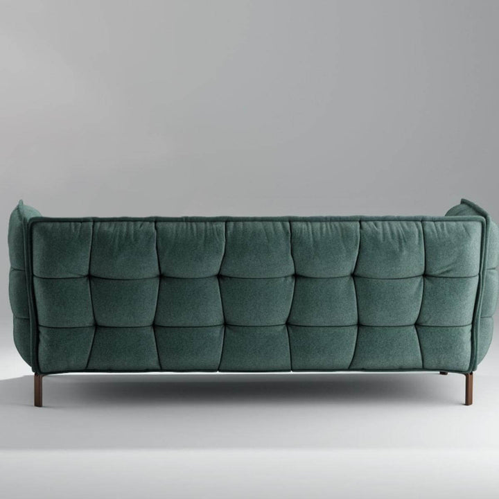 back side view of custom AeroLuxe deep green linen sofa with modern design and plush cushions