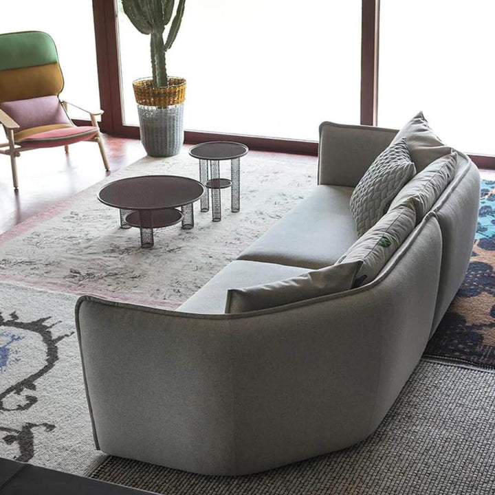 Back view of custom Astral Arc sofa featuring soft cotton linen upholstery and curved design
