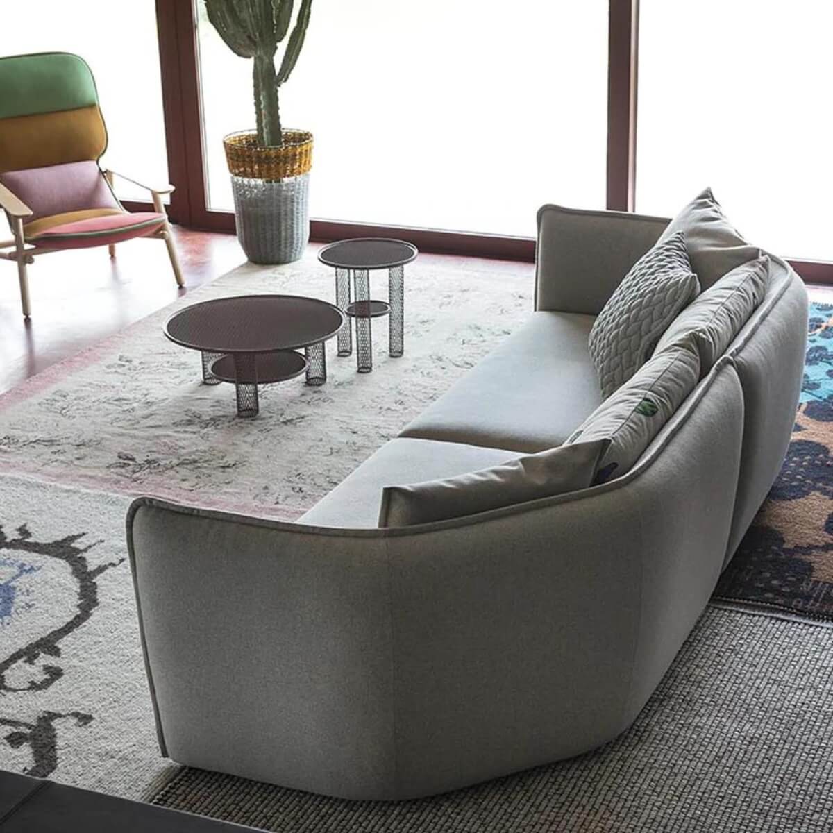 Back view of custom Astral Arc sofa featuring soft cotton linen upholstery and curved design