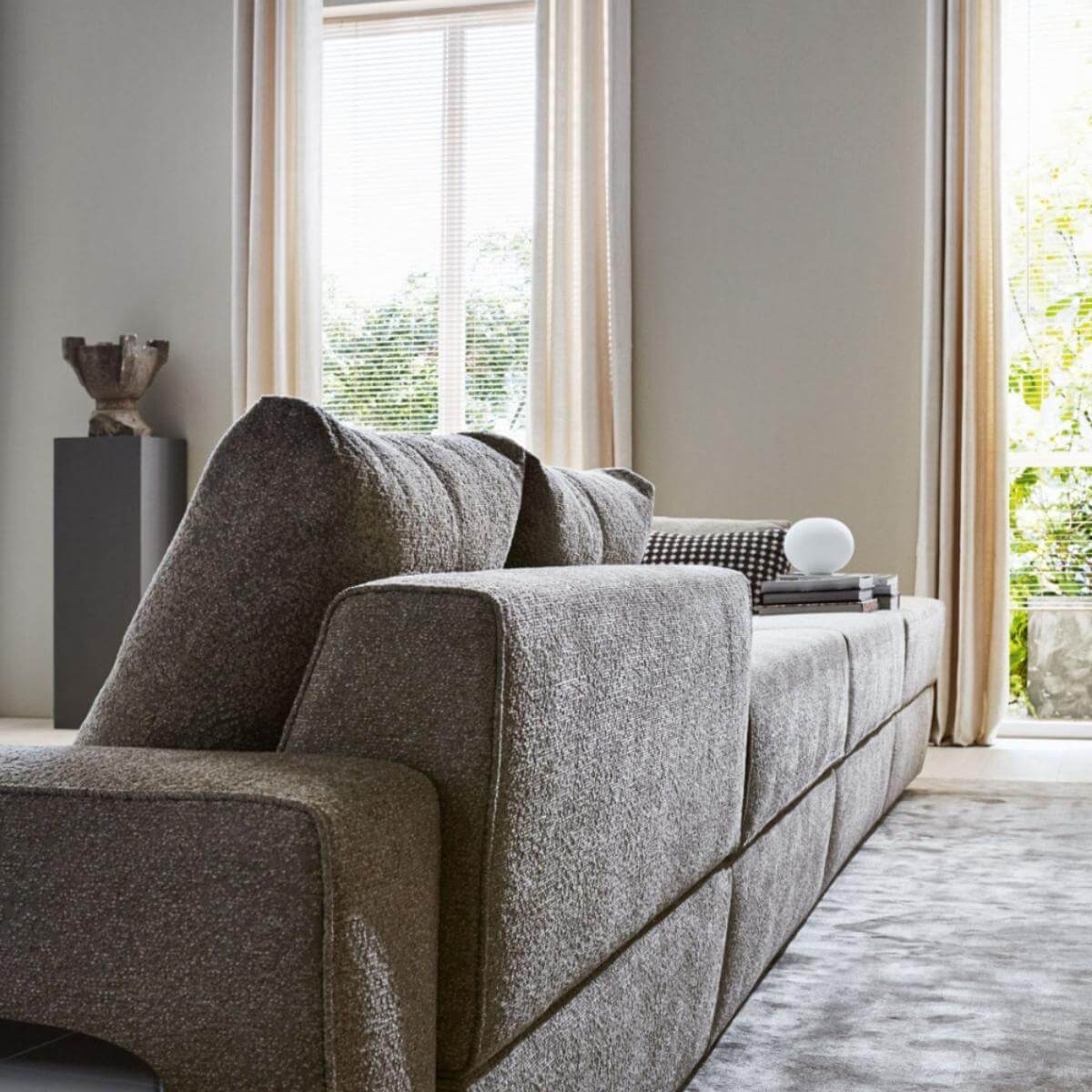 Rear angle of Avantgarde custom sofa featuring soft cotton linen fabric and sleek silhouette