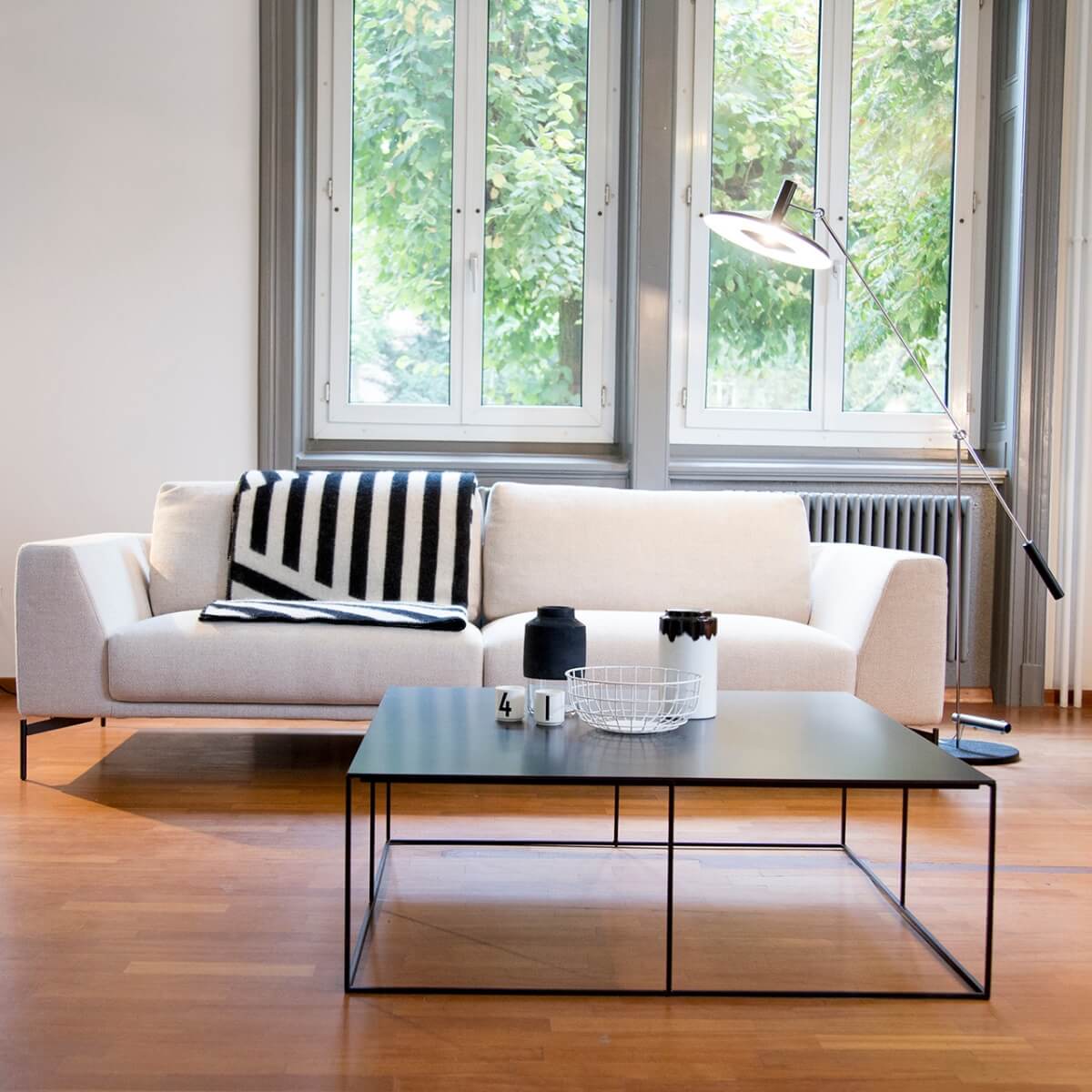Modern white cotton sofa from Beyond Boundaries collection with clean lines and cozy design
