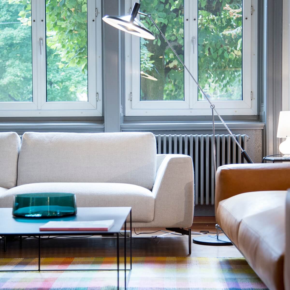 Contemporary custom-made white sofa featuring breathable cotton fabric and minimalist form