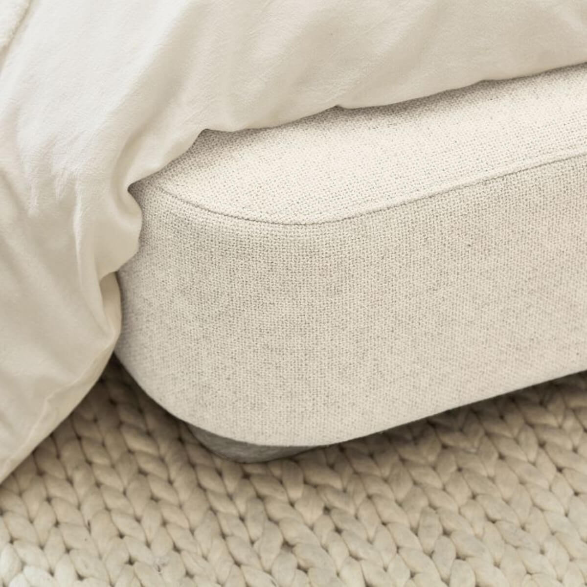 Close-up of custom Elegant Ergo wooden frame cotton linen bed headboard showing craftsmanship and texture