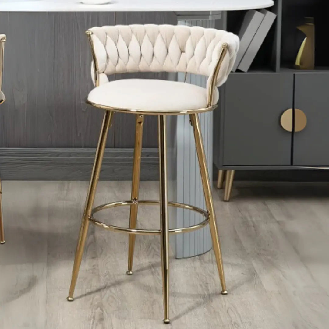 Front view of elegant white bar stool featuring golden metal base and sleek design
