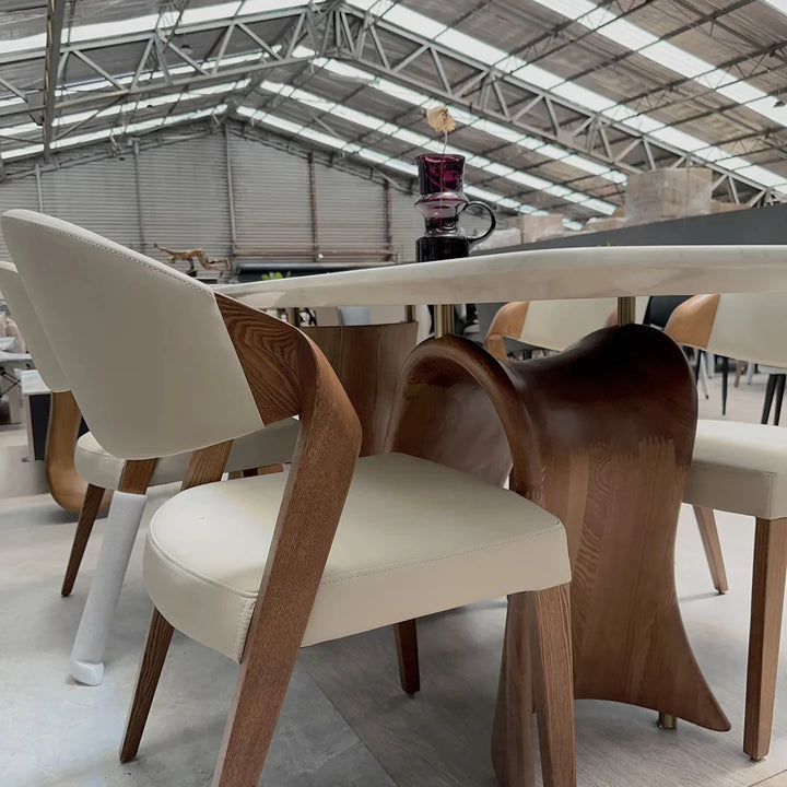 Close-up view of customised solid wood marble dining table stand highlighting craftsmanship